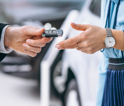 Female hands close up with car keys